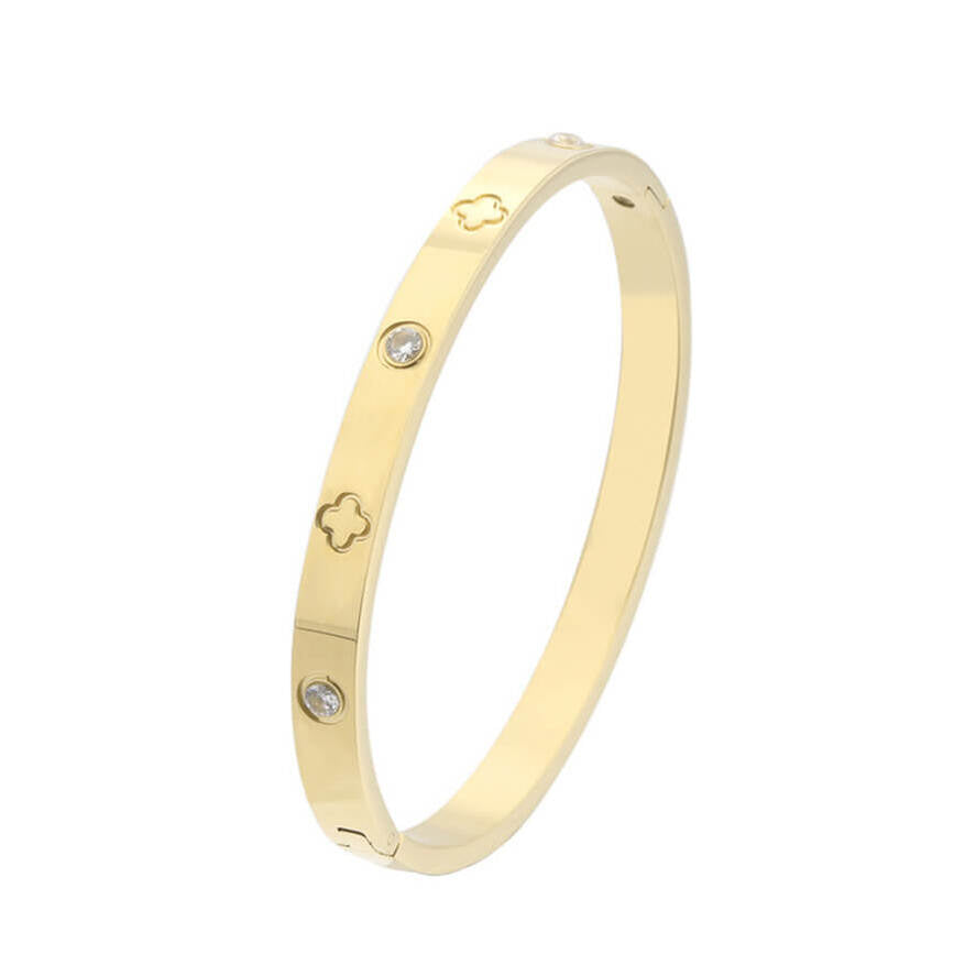 Un bracelet jonc chic orné de trèfles et zircons. Résistant à l’eau, en argent ou doré 18K. Élégance et chance au quotidien.