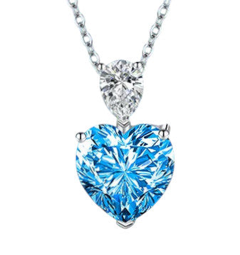 Collier Azuria en acier inoxydable, orné d’un cristal bleu éclatant en forme de cœur. Un bijou élégant, durable et lumineux pour sublimer chaque moment.