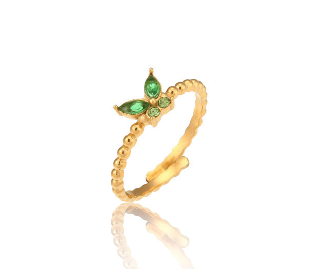 Bague Flora avec papillon en zircon vert ou blanc. Acier doré 18K, ajustable et waterproof, pour un style féminin et lumineux au quotidien.
