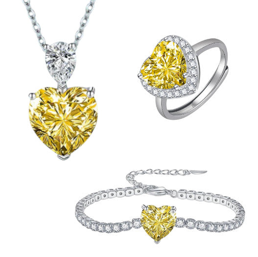 Parure Soléa en acier inoxydable argenté, ornée d’un cristal jaune éclatant en forme de cœur. Élégance, durabilité et brillance pour sublimer chaque instant.