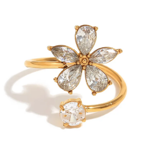 Bague Céleste fleur en acier inoxydable doré avec zircon. Élégante, romantique et résistante à l’eau. Ajustable et durable.
